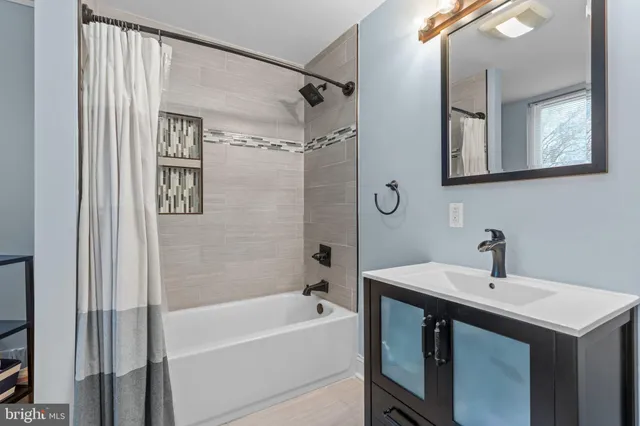 a bathroom with a toilet and a vanity