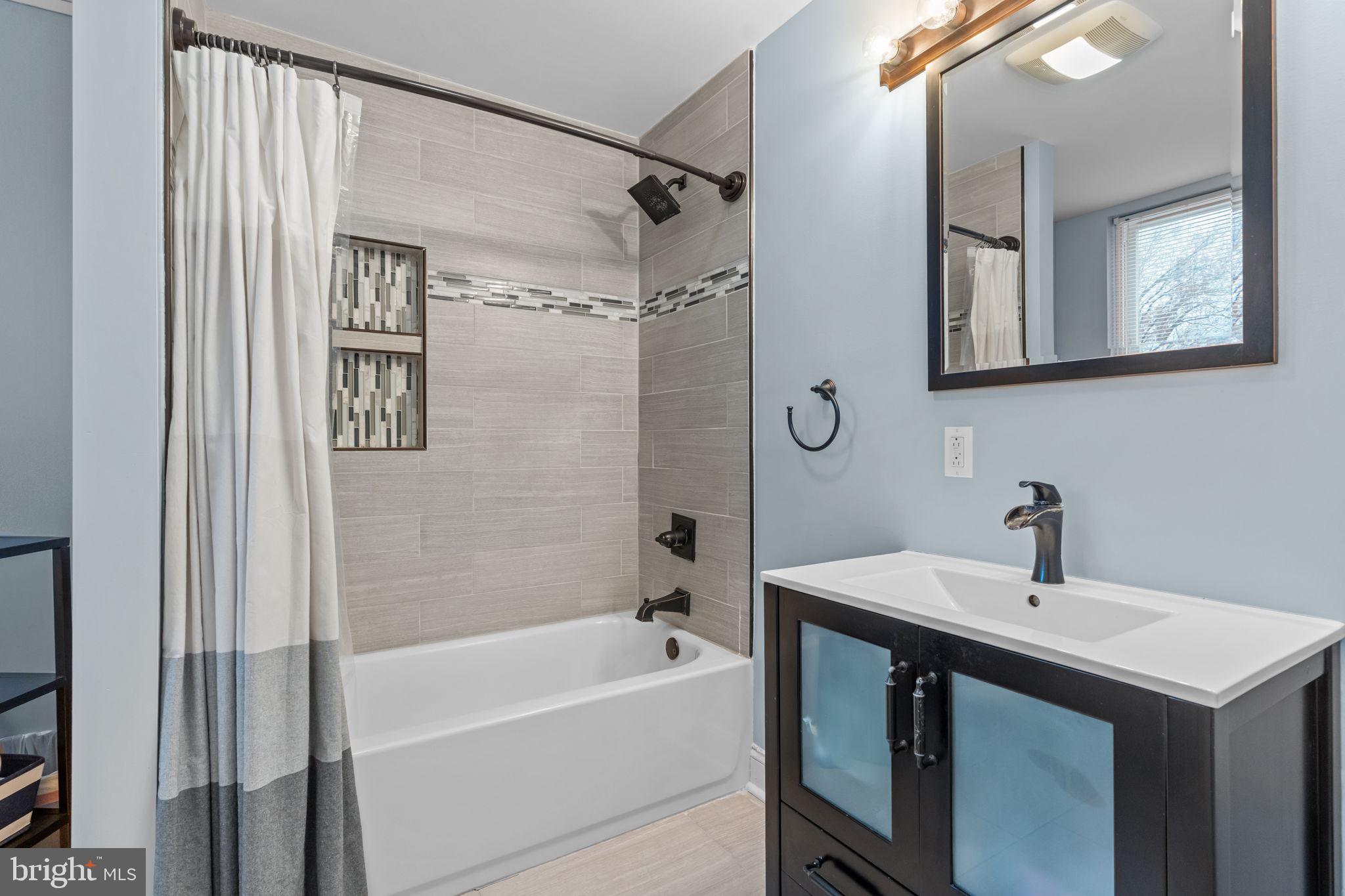 3554 New Queen Street Philadelphia, PA 19129 - Photo 19 of 39 a bathroom with a sink and a mirror