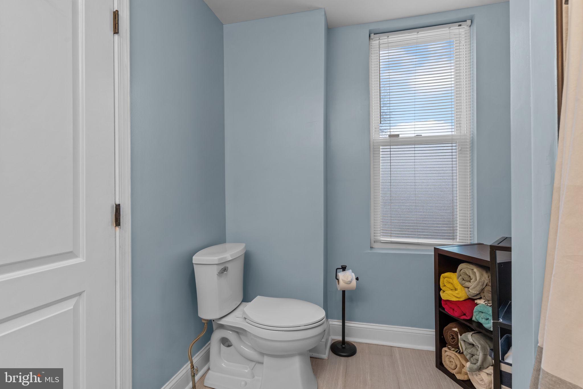3554 New Queen Street Philadelphia, PA 19129 - Photo 20 of 39 a bathroom with a toilet and a vanity