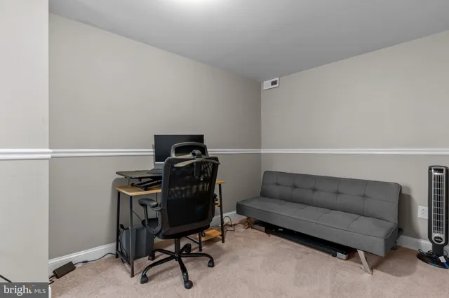 a view of a workspace with furniture