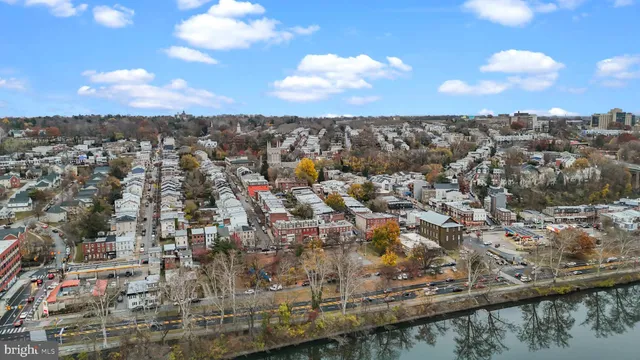 an aerial view of residential building with green space