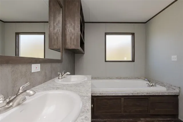 a bathroom with a sink and vanity