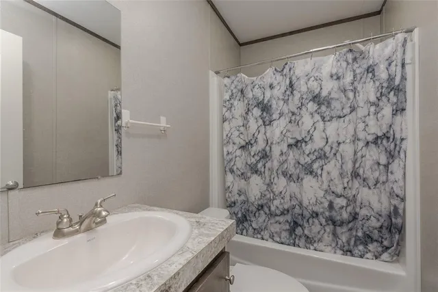 a view of a field with an ocean