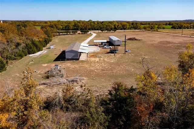 a view of a house with a snow in the background