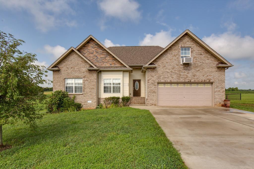 403 Coker Ford Road Portland, TN 37148 - Photo 1 of 29 a front view of a house with a yard and garage