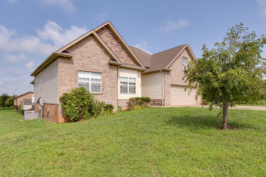 403 Coker Ford Road Portland, TN 37148 - Photo 2 of 29 a view of a house with backyard and garden