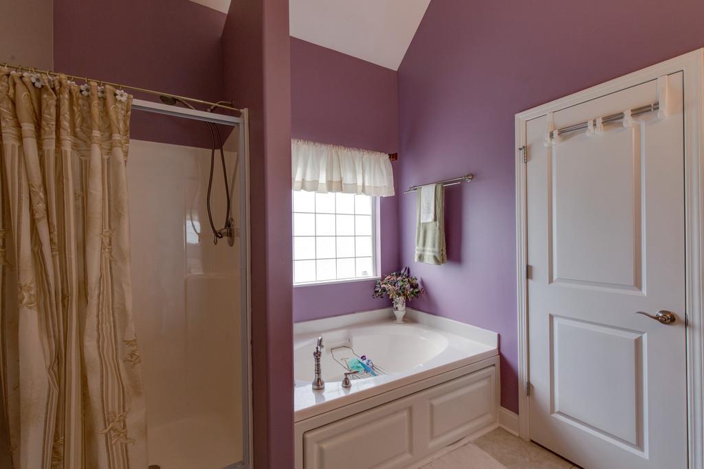 403 Coker Ford Road Portland, TN 37148 - Photo 13 of 29 a bathroom with a granite countertop sink and shower