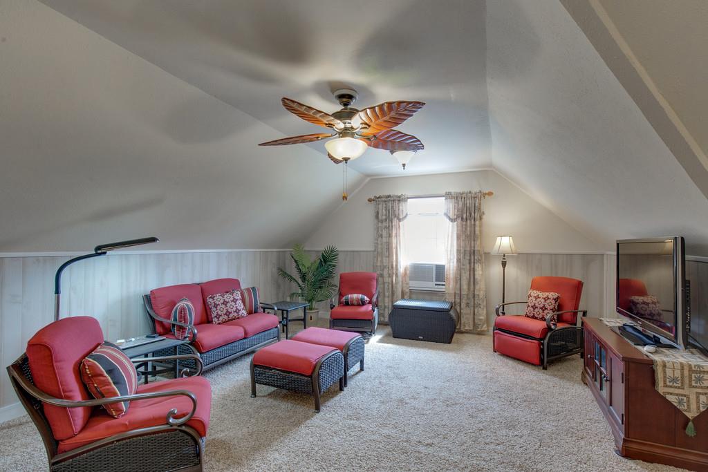 403 Coker Ford Road Portland, TN 37148 - Photo 16 of 29 a living room with furniture a ceiling fan and a rug