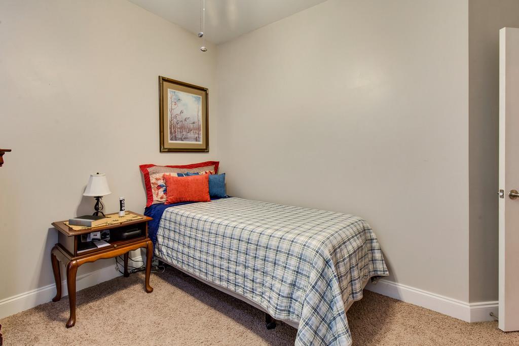 403 Coker Ford Road Portland, TN 37148 - Photo 20 of 29 a bedroom with a bed and dresser