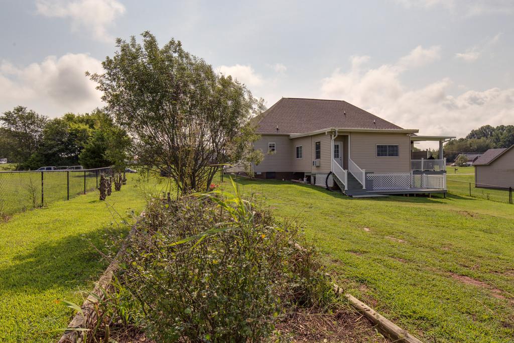 403 Coker Ford Road Portland, TN 37148 - Photo 27 of 29 a view of a house with a yard and sitting area