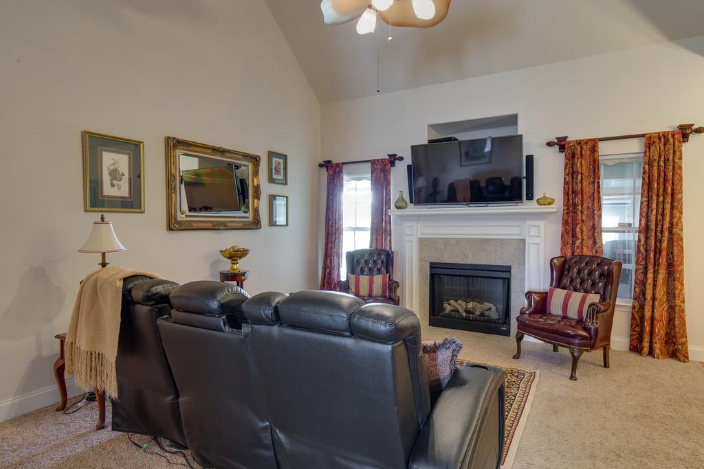 403 Coker Ford Road Portland, TN 37148 - Photo 4 of 29 a living room with furniture and a fireplace