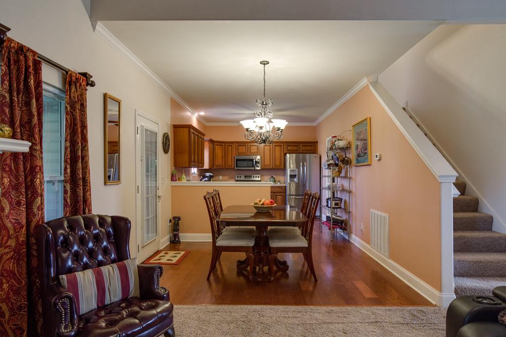 403 Coker Ford Road Portland, TN 37148 - Photo 6 of 29 a living room with furniture and a chandelier