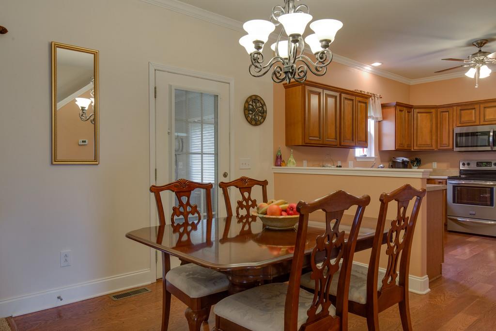 403 Coker Ford Road Portland, TN 37148 - Photo 9 of 29 a view of a dining room with furniture and a chandelier