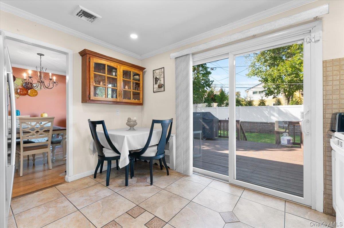 21 Eleanor Road Plainview, NY 11803 - Photo 12 of 39 a view of a dining room with furniture window and outside view
