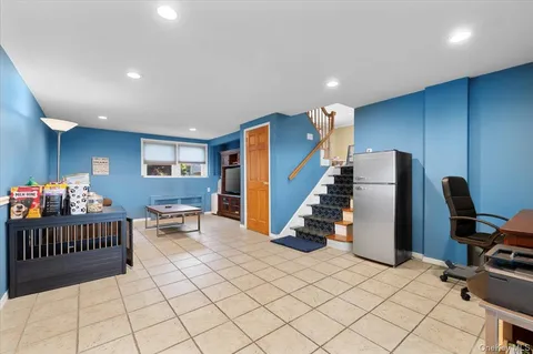 a view of entryway wih livingroom and stairs