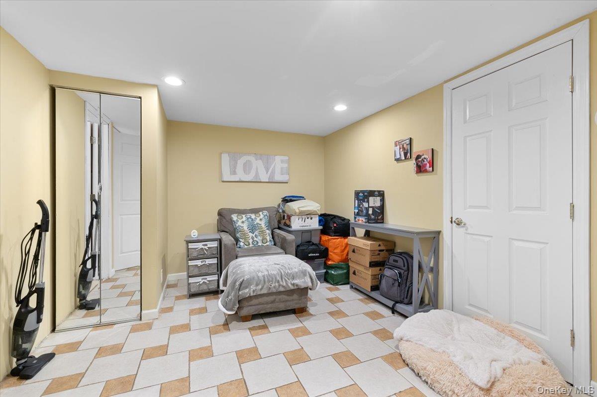 21 Eleanor Road Plainview, NY 11803 - Photo 23 of 39 a living room with furniture and a window