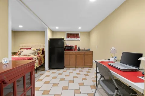 a kitchen with a refrigerator and a sink