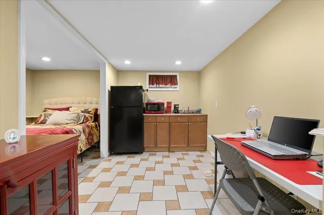 a kitchen with a refrigerator and a sink