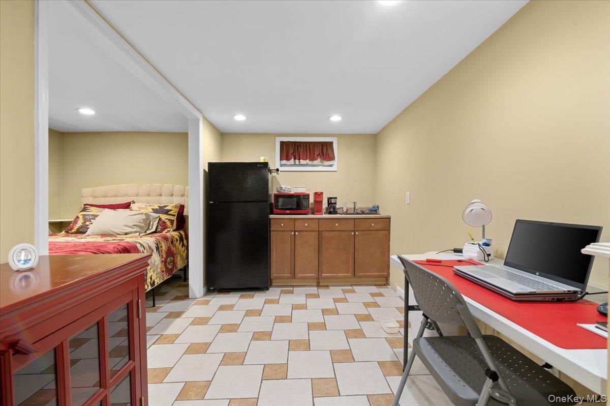21 Eleanor Road Plainview, NY 11803 - Photo 24 of 39 a kitchen with a refrigerator and a sink
