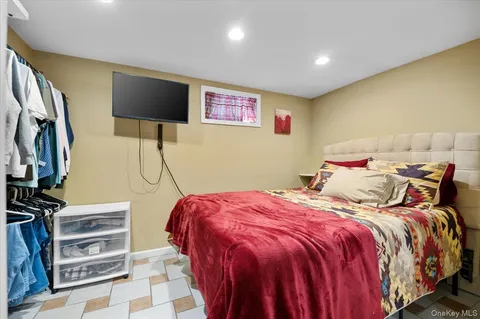 a bed room with a bed and a flat screen tv