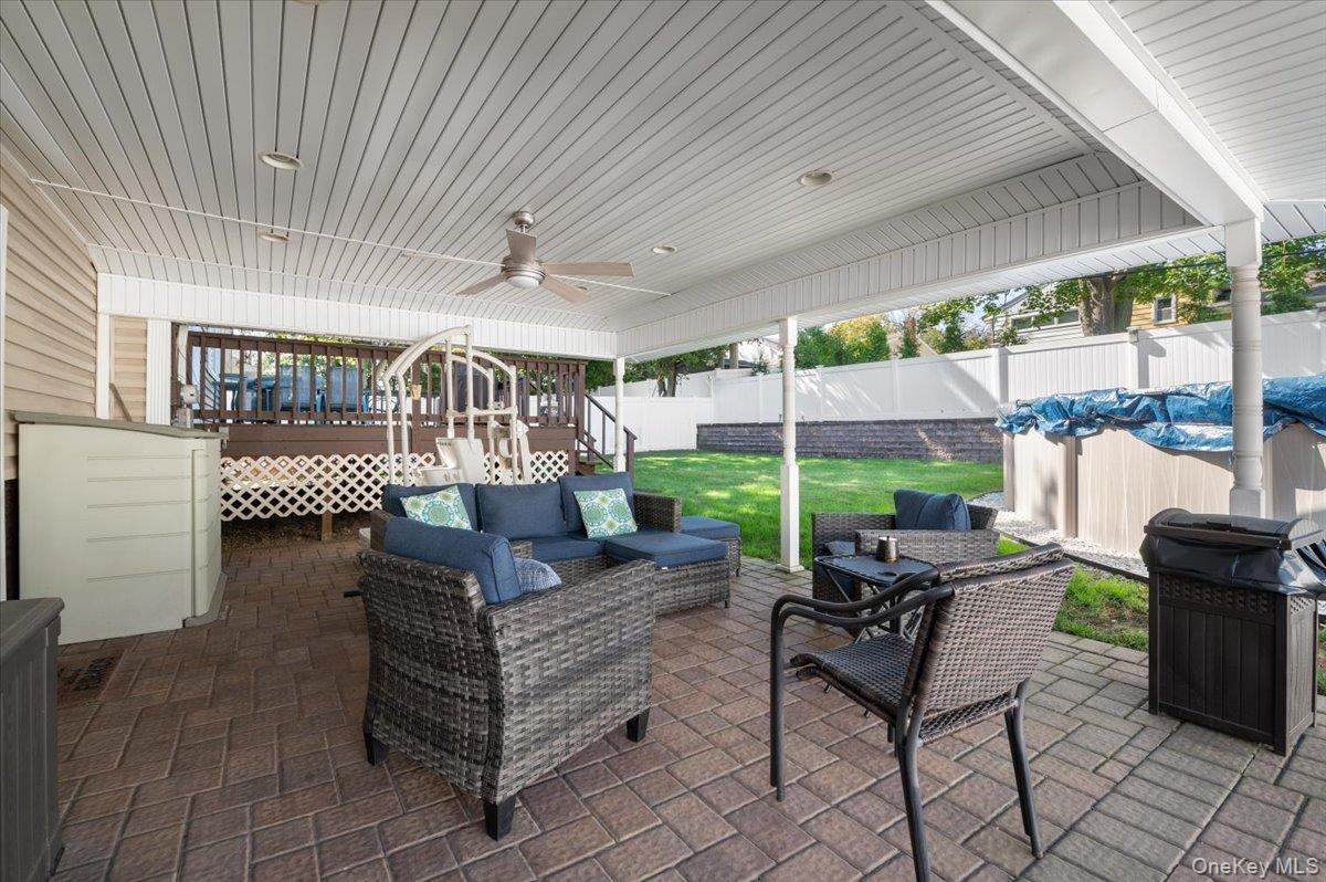 21 Eleanor Road Plainview, NY 11803 - Photo 28 of 39 a outdoor living space with furniture and a grill