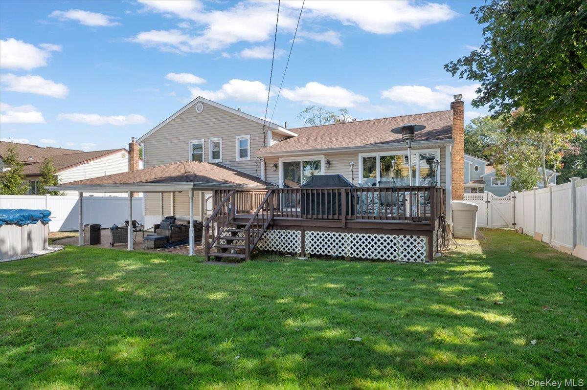 21 Eleanor Road Plainview, NY 11803 - Photo 31 of 39 a view of a house with a yard and deck