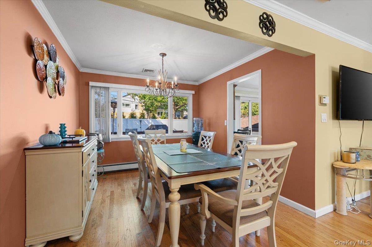 21 Eleanor Road Plainview, NY 11803 - Photo 6 of 39 a view of a dining room with furniture window and wooden floor