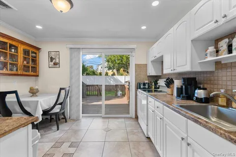a kitchen with stainless steel appliances granite countertop a sink and cabinets