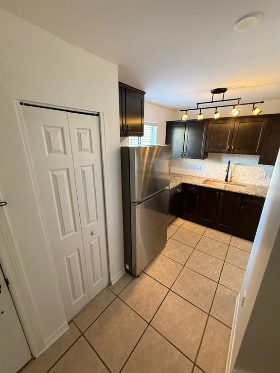22710 Watersedge Boulevard, Unit 73 Land O' Lakes, FL 34639 - Photo 25 of 39 a kitchen with stainless steel appliances a refrigerator and a sink