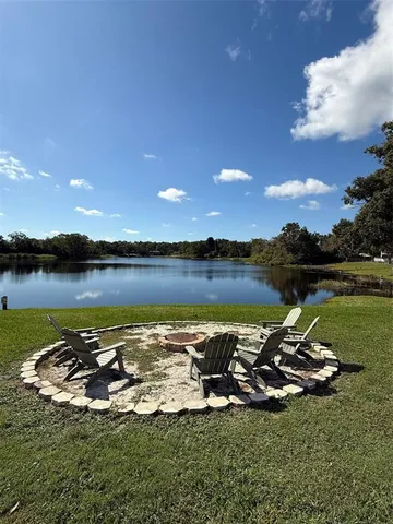 a view of a swimming pool with a yard