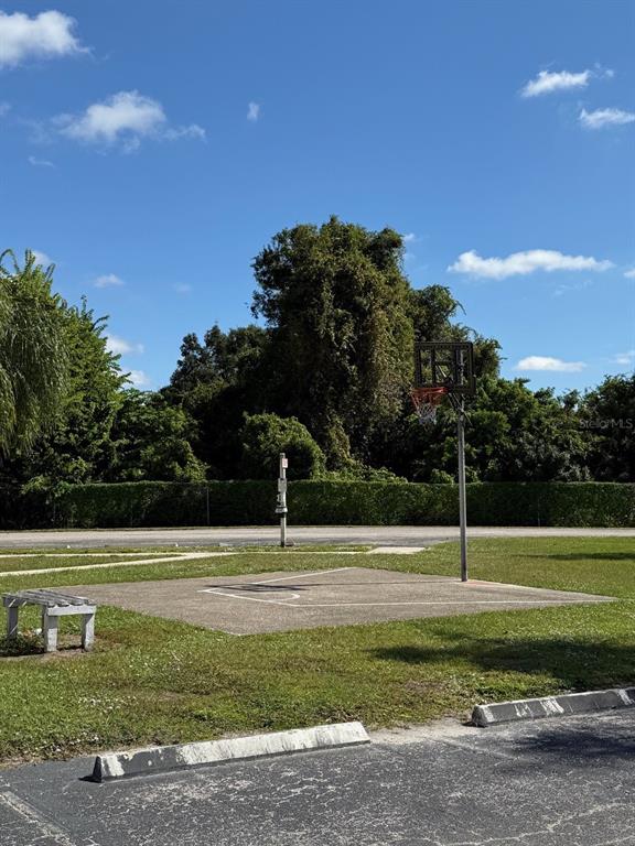 22710 Watersedge Boulevard, Unit 73 Land O' Lakes, FL 34639 - Photo 29 of 39 a view of a tennis court