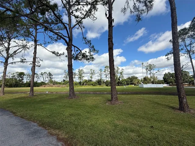 a view of a golf course with a lake view