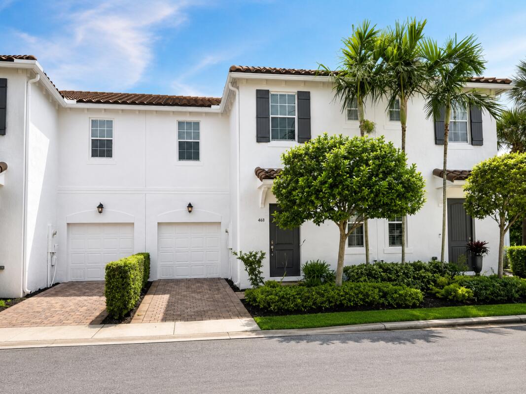 468 Francesca Ridge Road Boynton Beach, FL 33435 - Photo 1 of 11 a front view of a house with a yard and potted plants