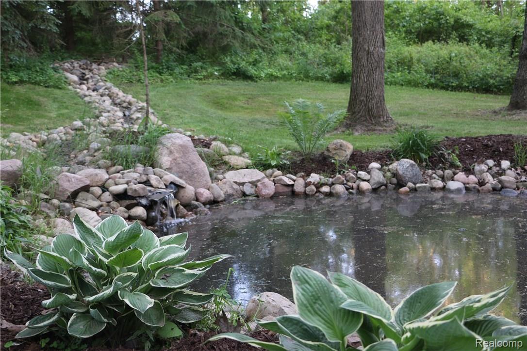 9404 Mabley Hill Road Fenton, MI 48430 - Photo 3 of 46 Pond with waterfall