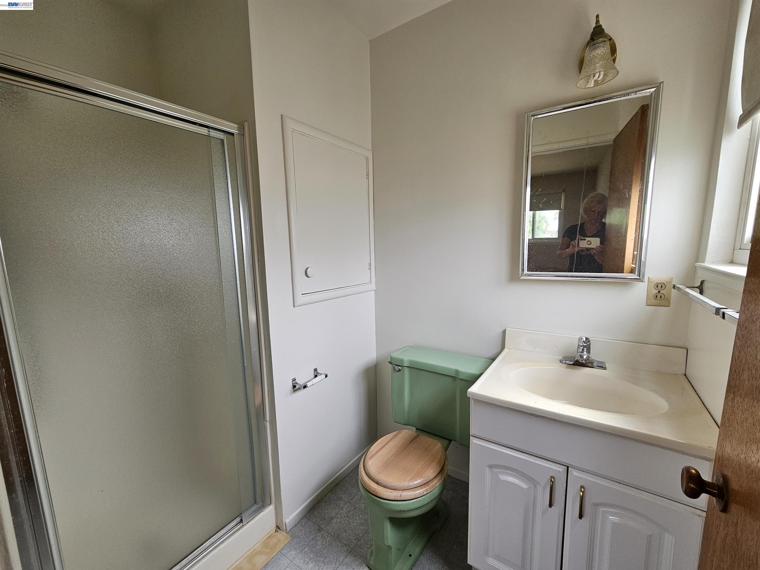 18758 Crane Avenue Castro Valley, CA 94546 - Photo 8 of 13 a bathroom with a toilet sink and mirror