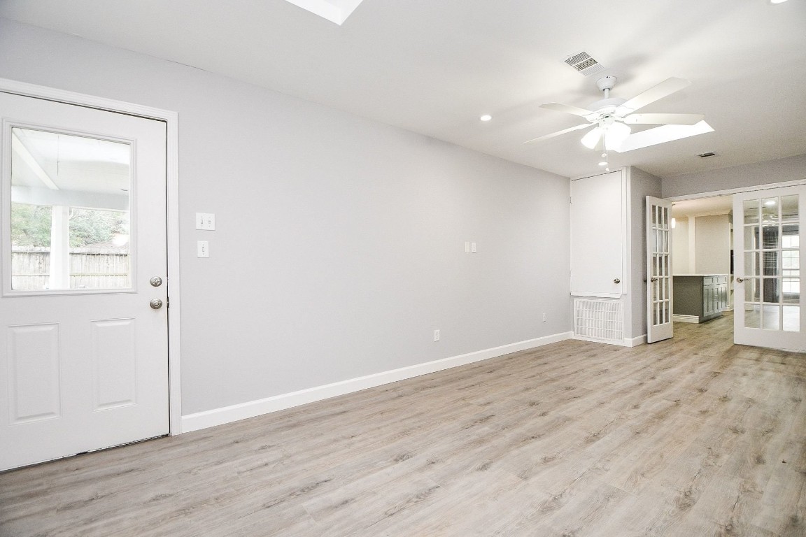 14011 Wickersham Lane Houston, TX 77077 - Photo 17 of 38 wooden floor in an empty room with a window