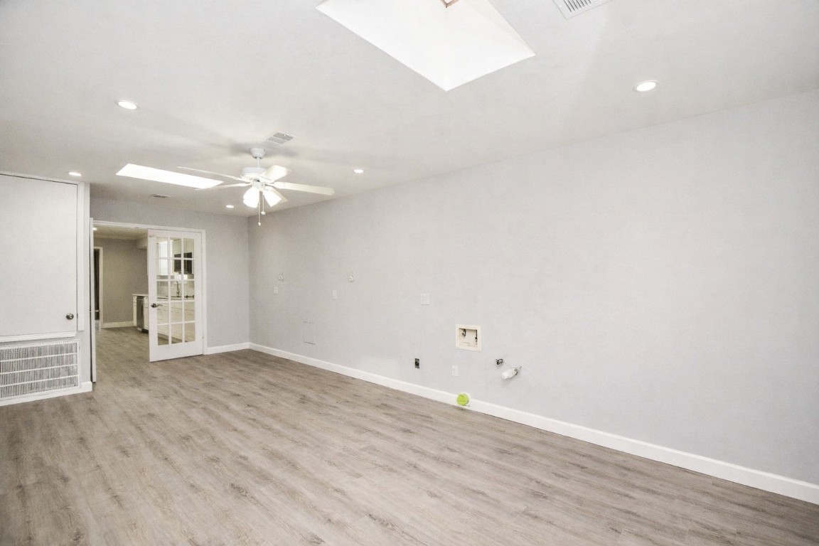 14011 Wickersham Lane Houston, TX 77077 - Photo 18 of 38 an empty room with wooden floor