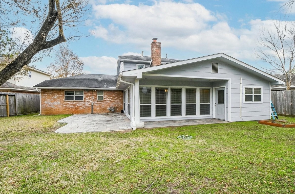 14011 Wickersham Lane Houston, TX 77077 - Photo 38 of 38 a front view of a house with a yard