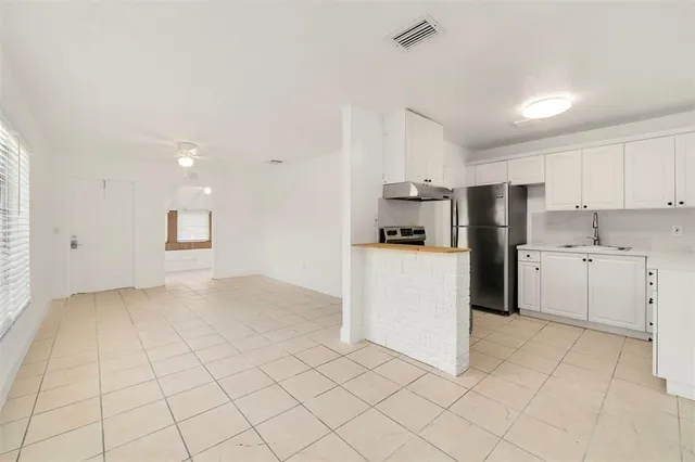 a view of a kitchen with electric appliances