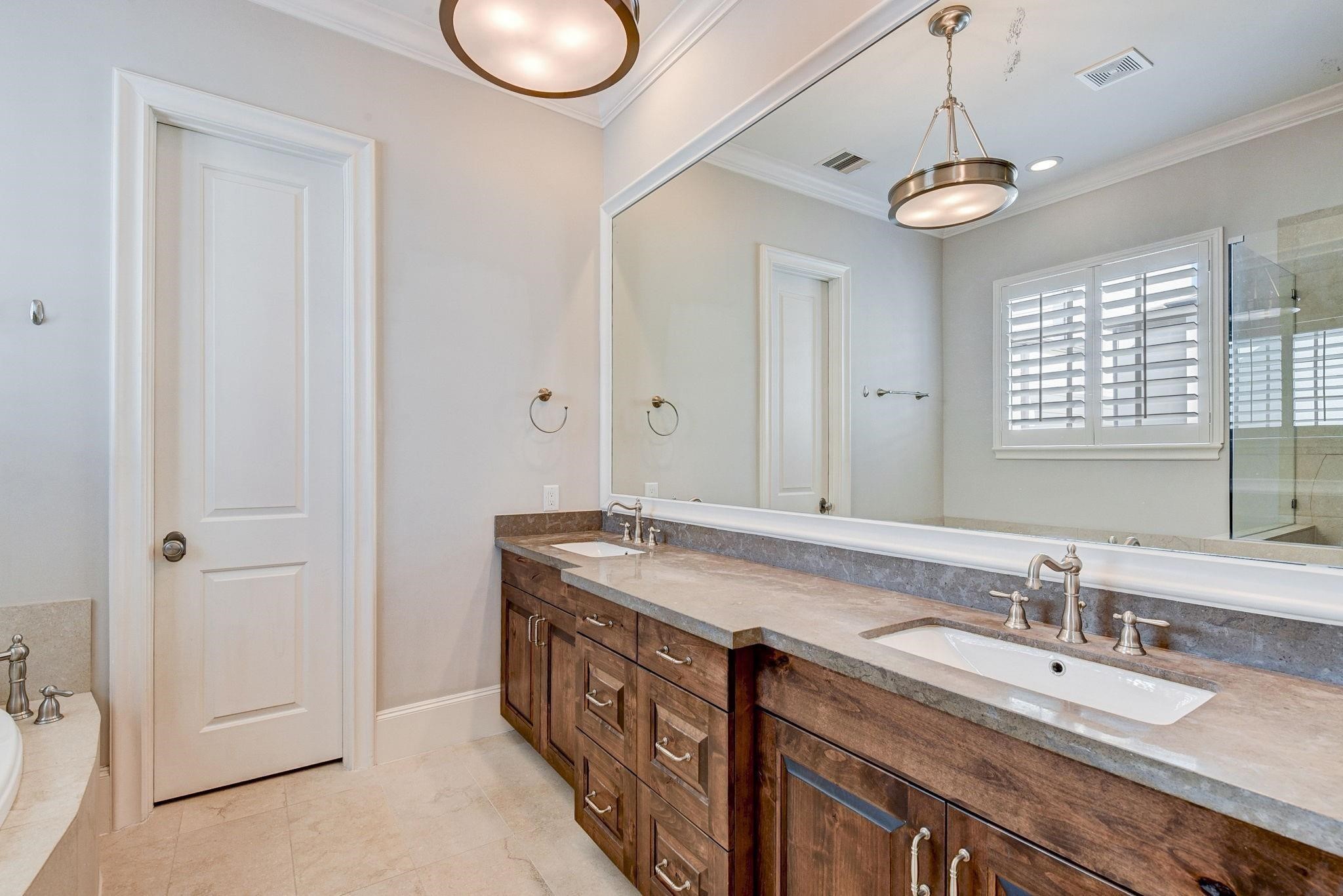 4506 Jackson Street Houston, TX 77004 - Photo 8 of 29 a bathroom with a granite countertop sink and a mirror