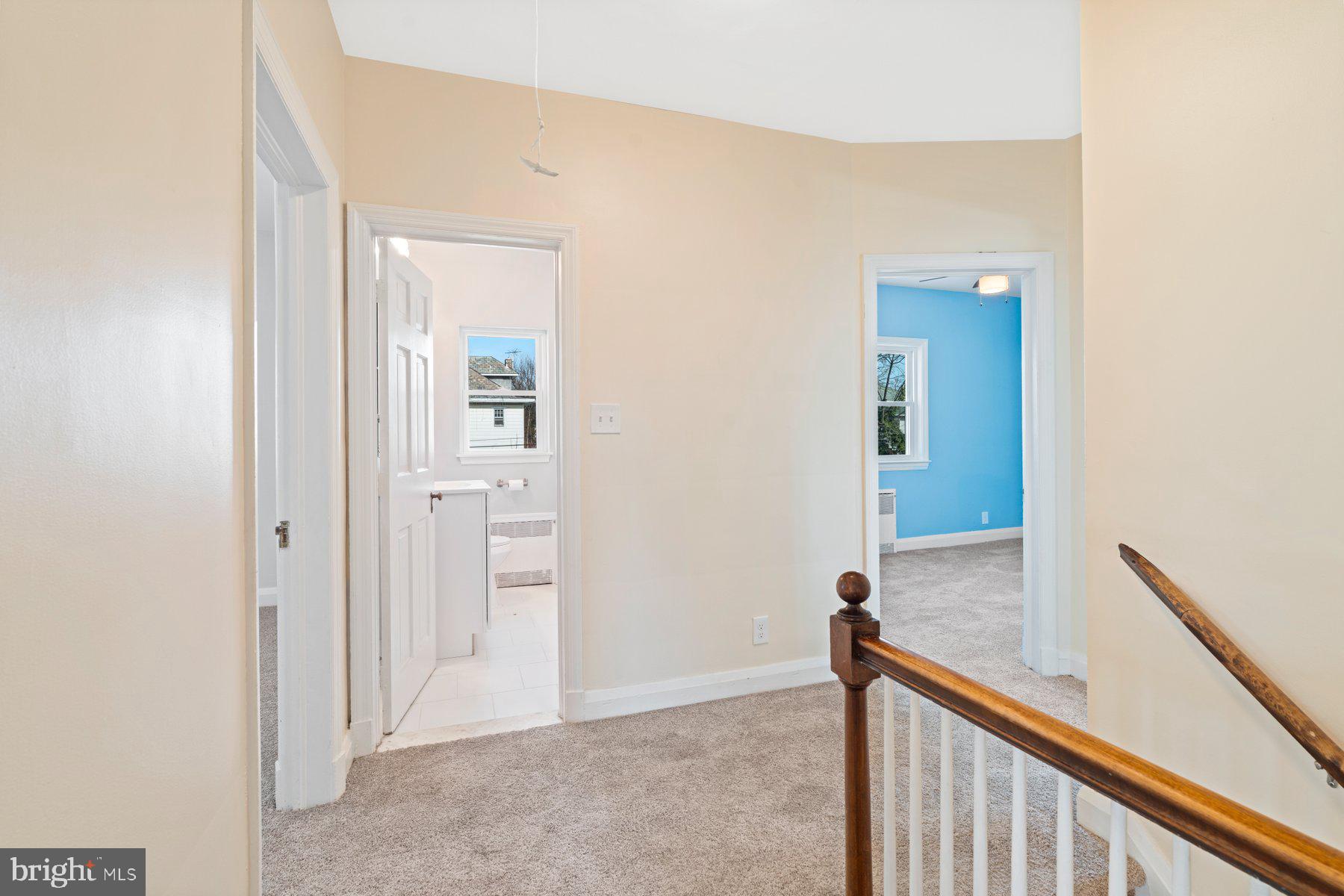 3704 Egerton Road Baltimore, MD 21215 - Photo 12 of 32 a view of a hallway with closet and mirror