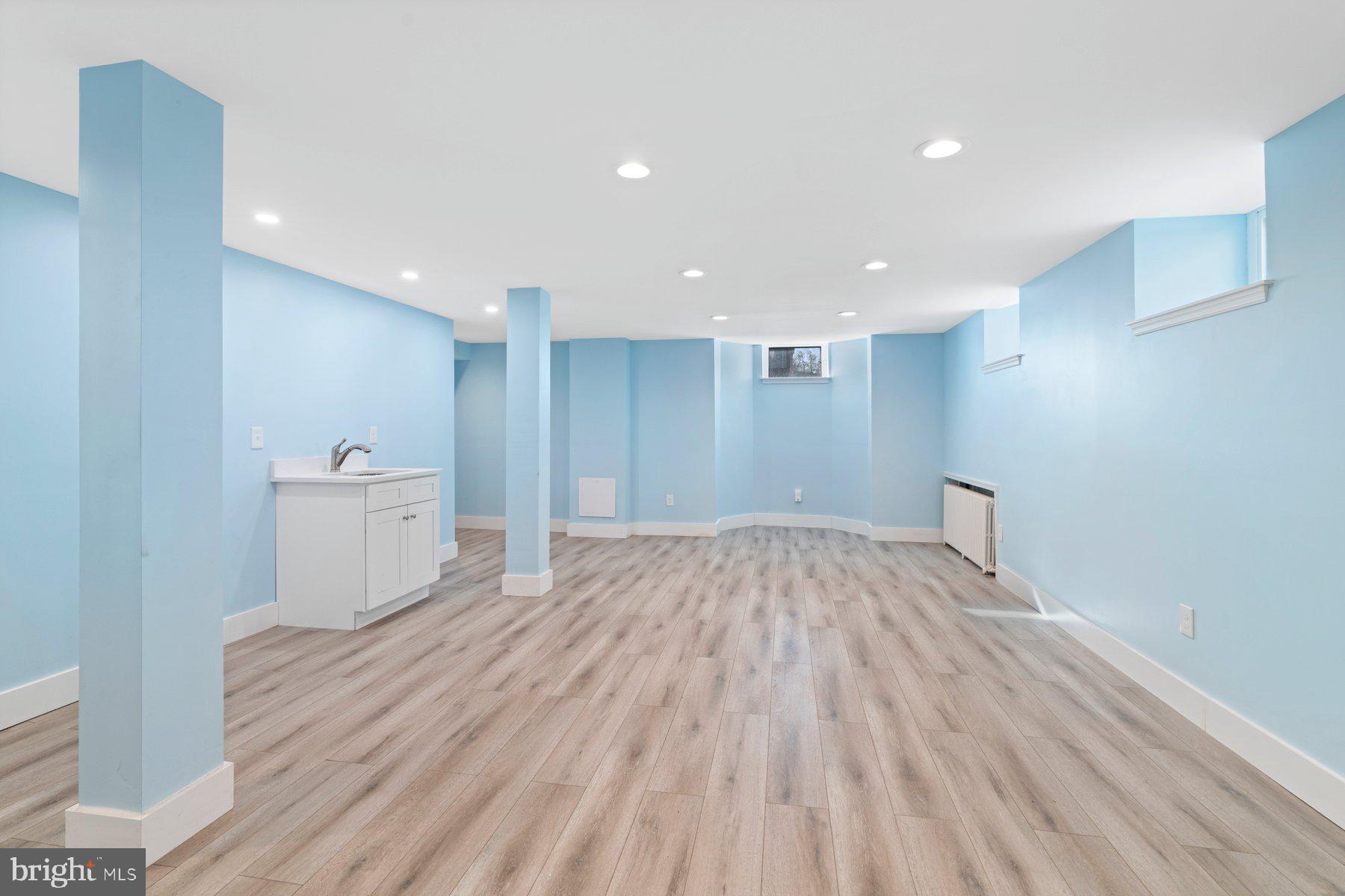 3704 Egerton Road Baltimore, MD 21215 - Photo 24 of 32 a view of empty room with wooden floor and sink