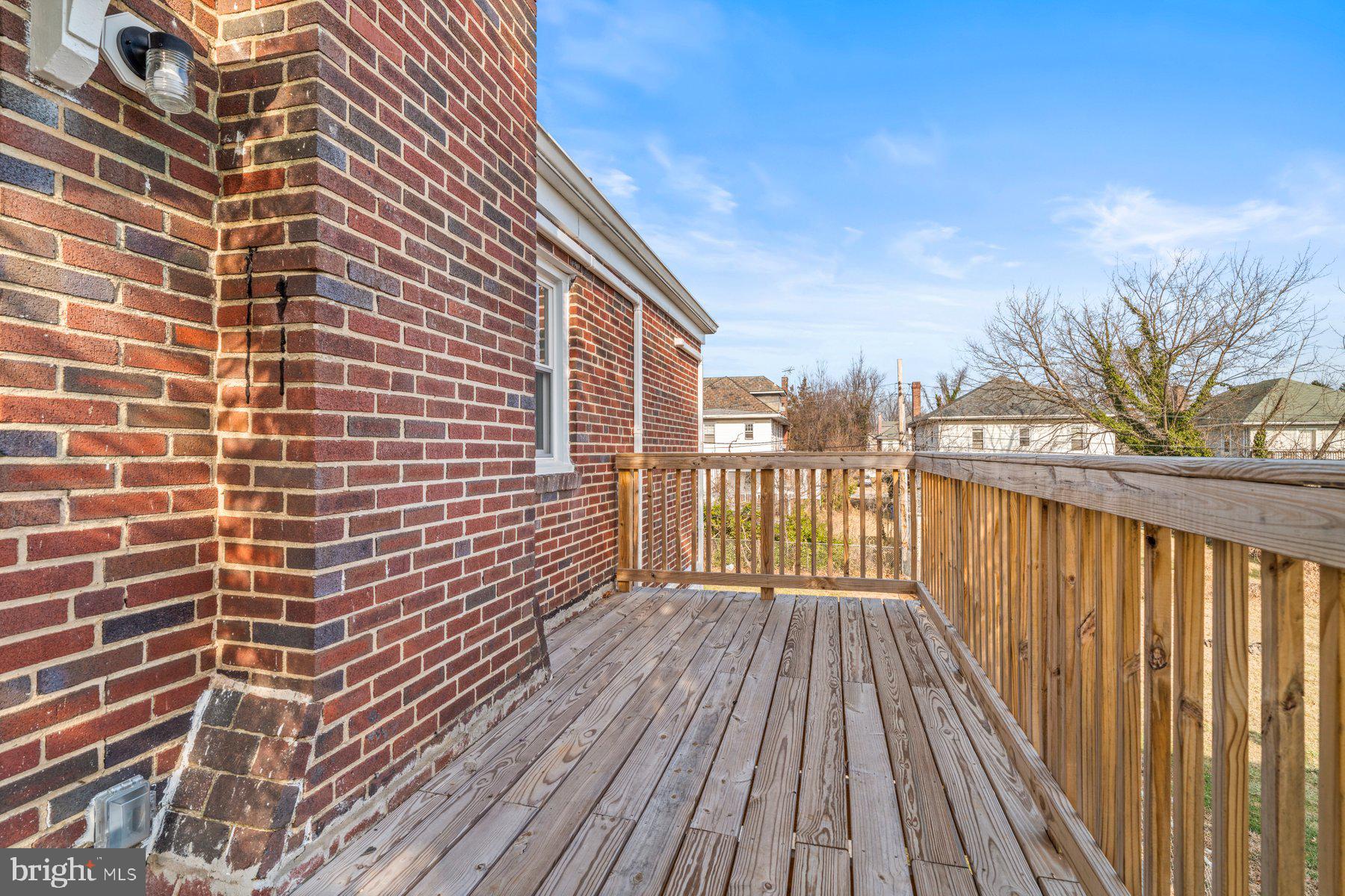 3704 Egerton Road Baltimore, MD 21215 - Photo 28 of 32 a view of a balcony with wooden floor and fence