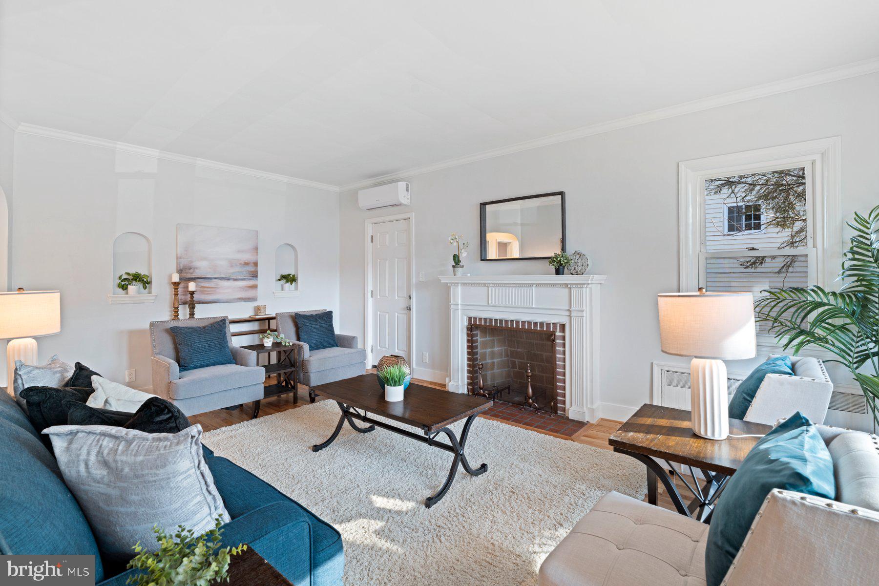 3704 Egerton Road Baltimore, MD 21215 - Photo 3 of 32 a living room with furniture and a fireplace