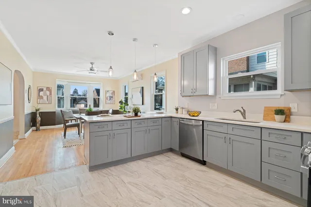 a kitchen with sink and cabinets