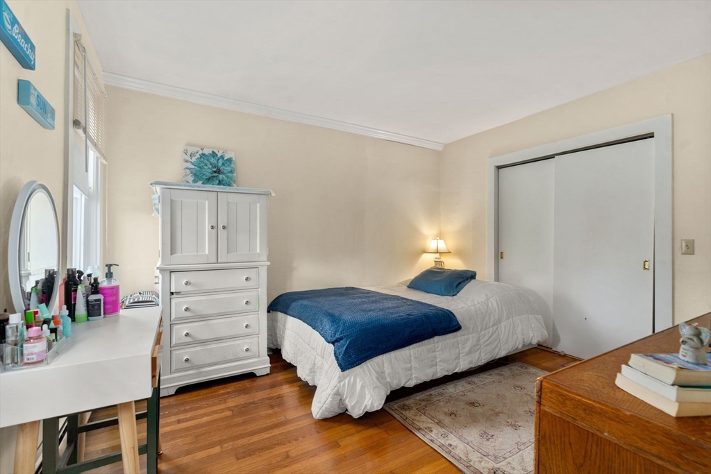 83 Fairhaven Road Mattapoisett, MA 02739 - Photo 6 of 41 a bedroom with a bed and wooden floor