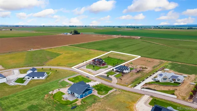 a view of a house with a yard and porch