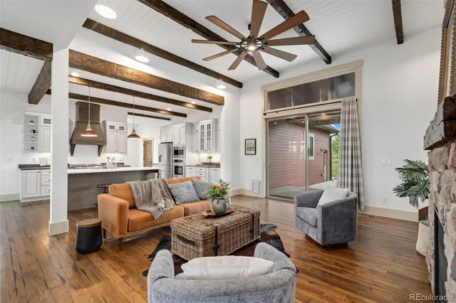 a view of a room with wooden floor