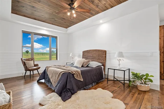 a bedroom with a bed and a lamp