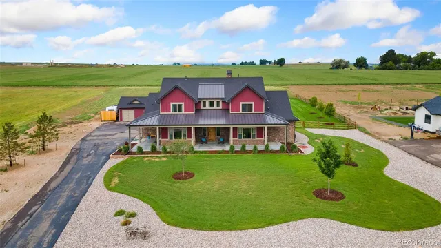 an aerial view of a house with a garden